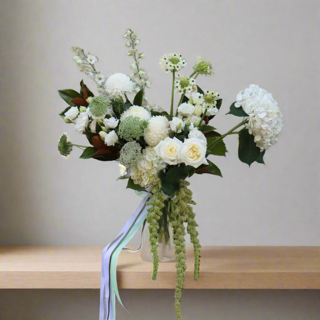 small white design with white hydrangea, white roses and green amaranthus