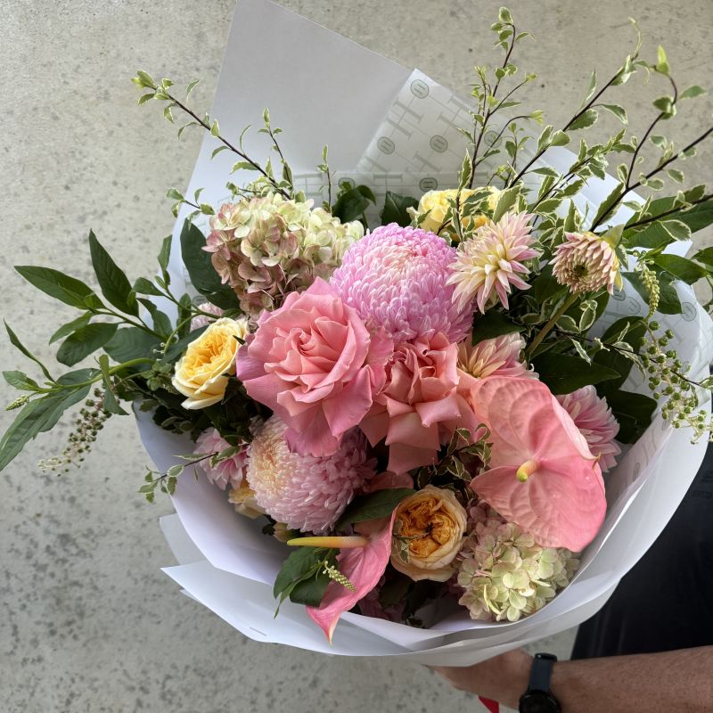 colourful bouquet with pink roses and pink anthuriums 