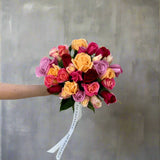 Rose Disco bouquet featuring a vibrant mix of colorful roses, including pink, orange, red, and yellow